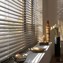 Aluminium blinds Cape Town home — warm timber tones lounge